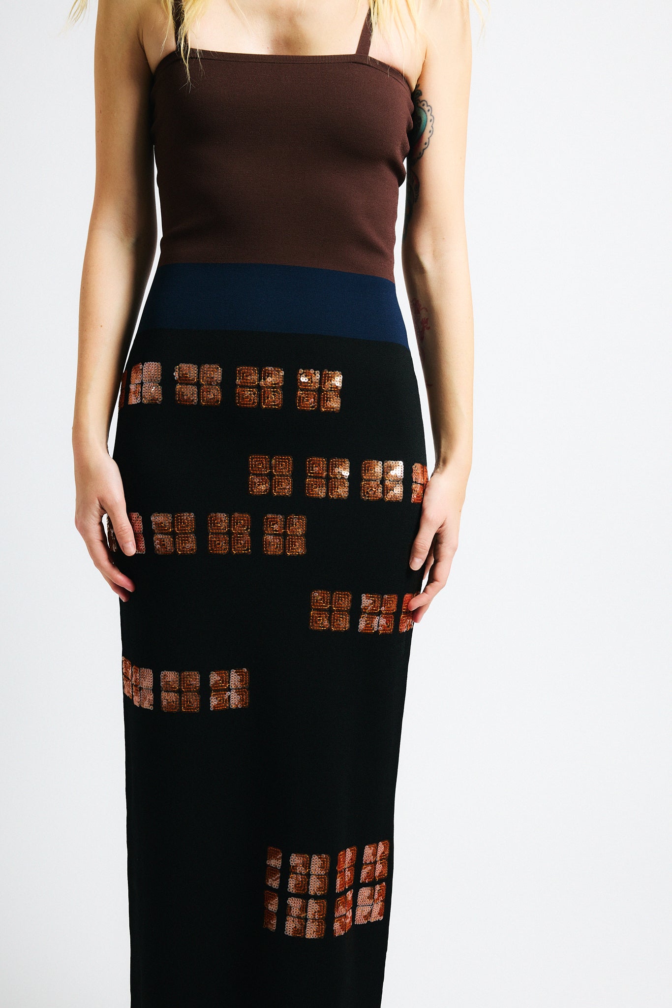 Link to "Antonia" dress. Image is of a female model wearing strapless brown/black sequin dress.